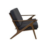 Modern armchair with dark gray cushion and wooden frame on a white background