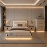 A modern bedroom featuring a low-profile platform bed with warm LED under-bed lighting, matching nightstands, a tall white dresser, and a light gray textured rug on a light wood floor.