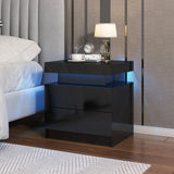 Black nightstand with decorative items in a bedroom setting