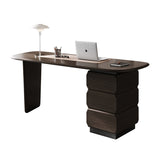 Modern dark wood desk with a laptop, lamp, and other items on a white background